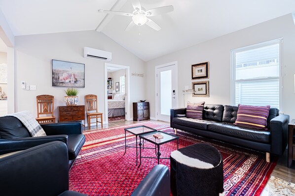 Cozy and spacious living area with TV