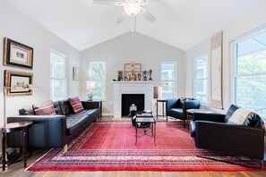 Cozy and spacious living area with TV