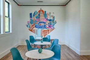 The polished communal Kitchen & Dining Area hosts several comfortable spaces to gather for meals