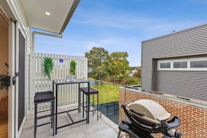 Upstairs balcony, outdoor setting and webber