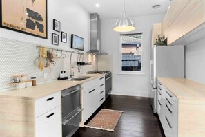 Large kitchen with everything you'll need, fridge, dishwasher, oven, microwave and plenty of cooking equipment.