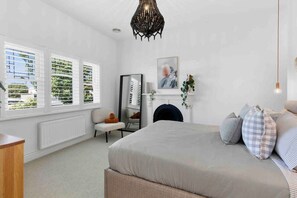 Bedroom 1- Master with Queen bed, walk in wardrobe, ensuite, ornamental fireplace.