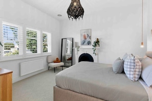 Bedroom 1- Master with Queen bed, walk in wardrobe, ensuite, ornamental fireplace.