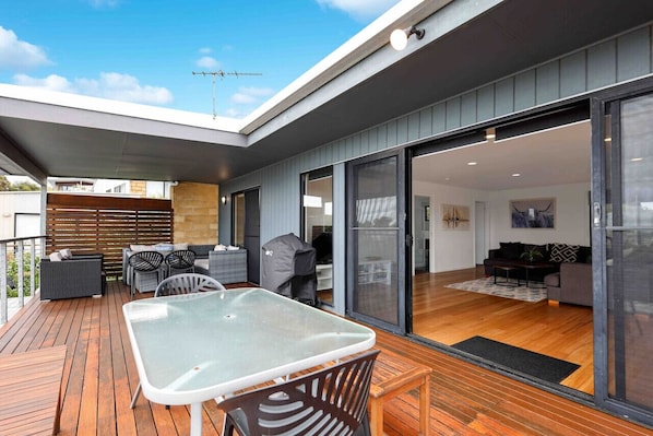 Lounge Room, Dining Room and MASSIVE Balcony with table, Weber BBQ, outdoor lounge setting & views.4