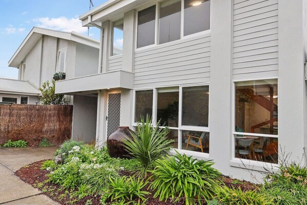 Private entrance and carport