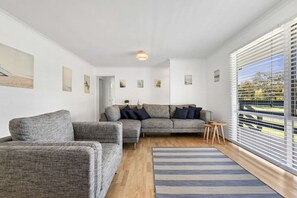 Large open lounge with comfy sofas, smart tv, reverse cycle air-conditioning and heating