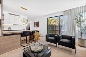 Downstairs: Stunning kitchen with European appliances, adjoining dining and lounge.