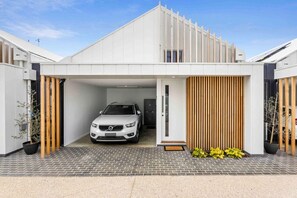 A private carport is accessed via the security gate entrance