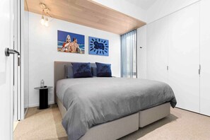 A master bedroom with an ensuite & luxurious king-size bed