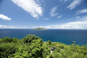 Perched on a hillside with panoramic views, this property is nothing short of breathtaking.