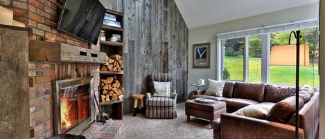 Living room with wood fireplace.