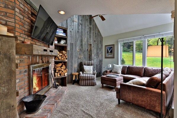 Living room with wood fireplace.