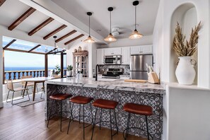 Cook in style with a modern kitchen and stunning stone countertop.