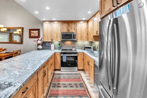 Kitchen: Well-equipped kitchen, updated appliances, drip coffee maker, crockpot, blender, kitchen bar with 3 bar stools
