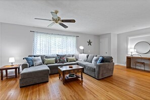 Bright and spacious living room with plenty of seating on the comfortable sectional couch!