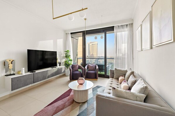 Living Room: Bright and airy with stunning views, chic furnishings, and a relaxing vibe awaits you!