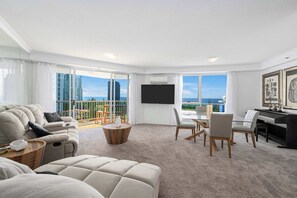 Open plan lounge dining area with ocean views