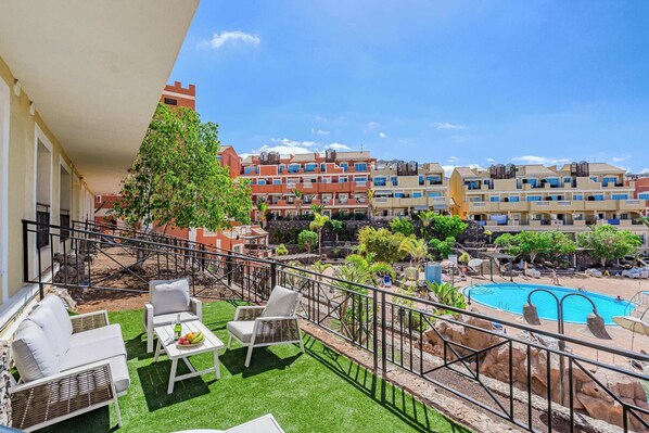 Patio with Outdoor Seating and Dining Area, Sun Lounger and Pool View