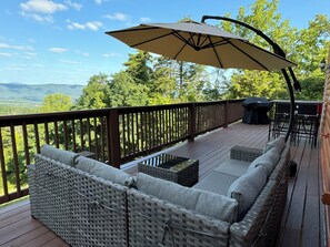 Deck has sectional, umbrella and bar height table to enjoy the sunset. 