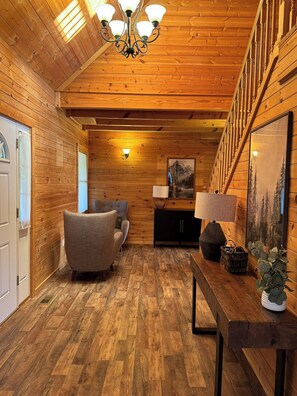 Entry from dining area with view of cozy conversation corner 
