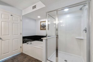 After a fun day on the beach, sink into the soaker tub with a glass of wine.