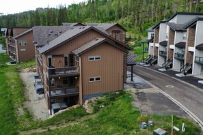 view from above showing the private deck and hot tub, plus all 3 decks connected to the unit