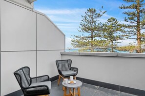 Blissful views over the ocean await you on the balcony. This apartment is a true coastal retreat.
