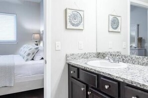 Master bath complete with towels, shampoo, conditioner and body wash