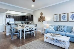 Beach themed decor, comfortable couch and loveseat and 55" tv