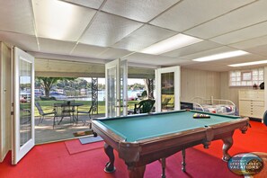 Basement is game time with pool table by the bar. Lots of seating! Day bed and full bathroom.