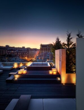 Sundeck with jacuzzi and lounge area