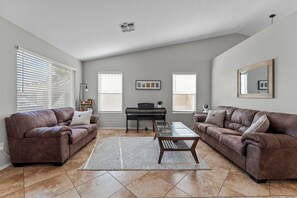 Welcome to the heart of our stylish retreat! Our living room exudes comfort and modern charm, featuring plush furnishings and contemporary decor. 
