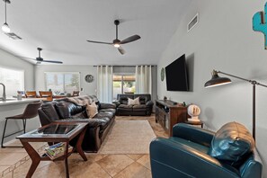 Welcome to the heart of our stylish retreat! Our living room exudes comfort and modern charm, featuring plush furnishings and contemporary decor. 
