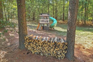 Let the kids play and explore in the playground surrounded by natural wood elements—a perfect blend of fun and nature.
