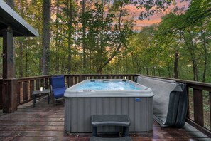 Soak up the beautiful atmosphere with our private hot tub on the patio, surrounded by nature's beauty!