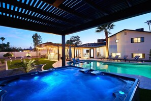 Relax in this Scottsdale oasis with a pool, hot tub, grill under bistro lights, putting green, chess, horseshoes, corn hole, fire pit, and outdoor dining for the perfect getaway.