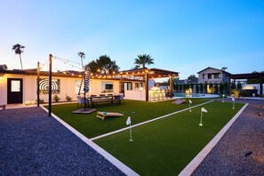 Relax in this Scottsdale oasis with a pool, hot tub, grill under bistro lights, putting green, chess, horseshoes, corn hole, fire pit, and outdoor dining for the perfect getaway.