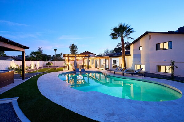 Relax in this Scottsdale oasis with a pool, hot tub, grill under bistro lights, putting green, chess, horseshoes, corn hole, fire pit, and outdoor dining for the perfect getaway.