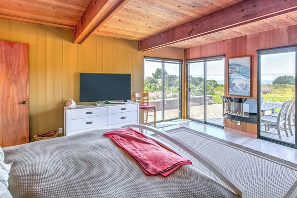 Master bedroom: California King bed with TV, en suite bathroom and patio access