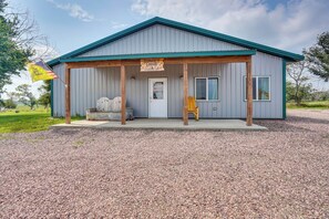 Cabin Exterior | Covered Porch | Private Hot Tub