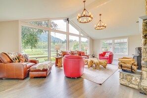 Living Room | Stone Fireplace | Pond Views | 1st Floor