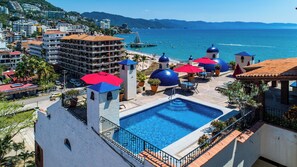 Shared Rooftop Pool Area with Heated Pool and Fridge to keep drinks cold!
