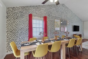 Dining area with 10 plush seats and ceiling fan