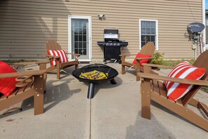 4 adirondack chairs around firepit, bbq available as well