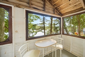 Indoor living with dining set wit lake view