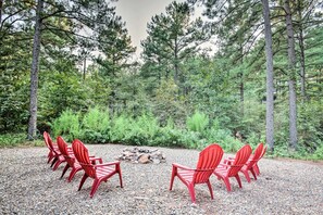 Outdoor Fire Pit: Gather around vibrant chairs for unforgettable evenings under the stars!