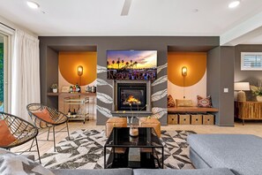 Living room features custom cabinetry and 65" Sony Bravia OLED 4K TV