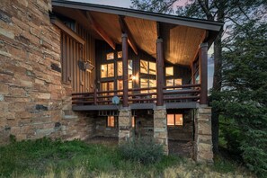 Exterior: View of back deck, 8-person hot tub, outdoor heater, outdoor dining table