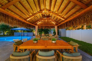 Set the scene for unforgettable evenings with outdoor dining under the tiki hut—where good food and great company meet.