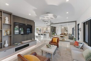 Main House: With plenty of room to stretch out, the large plush sofa and cozy leathered seating make this living room the perfect spot for family gatherings.
